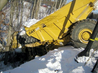 Illustration for article titled Giant Dump Truck Tries Sledding, Fails Miserably